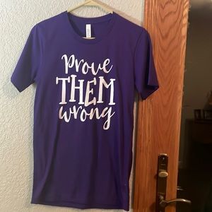 purple shirt with stains on it